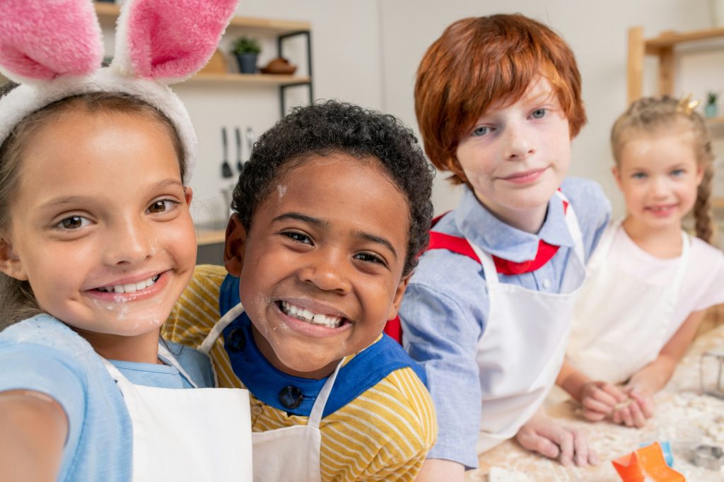 Happy multi-ethnic kids in kitchen